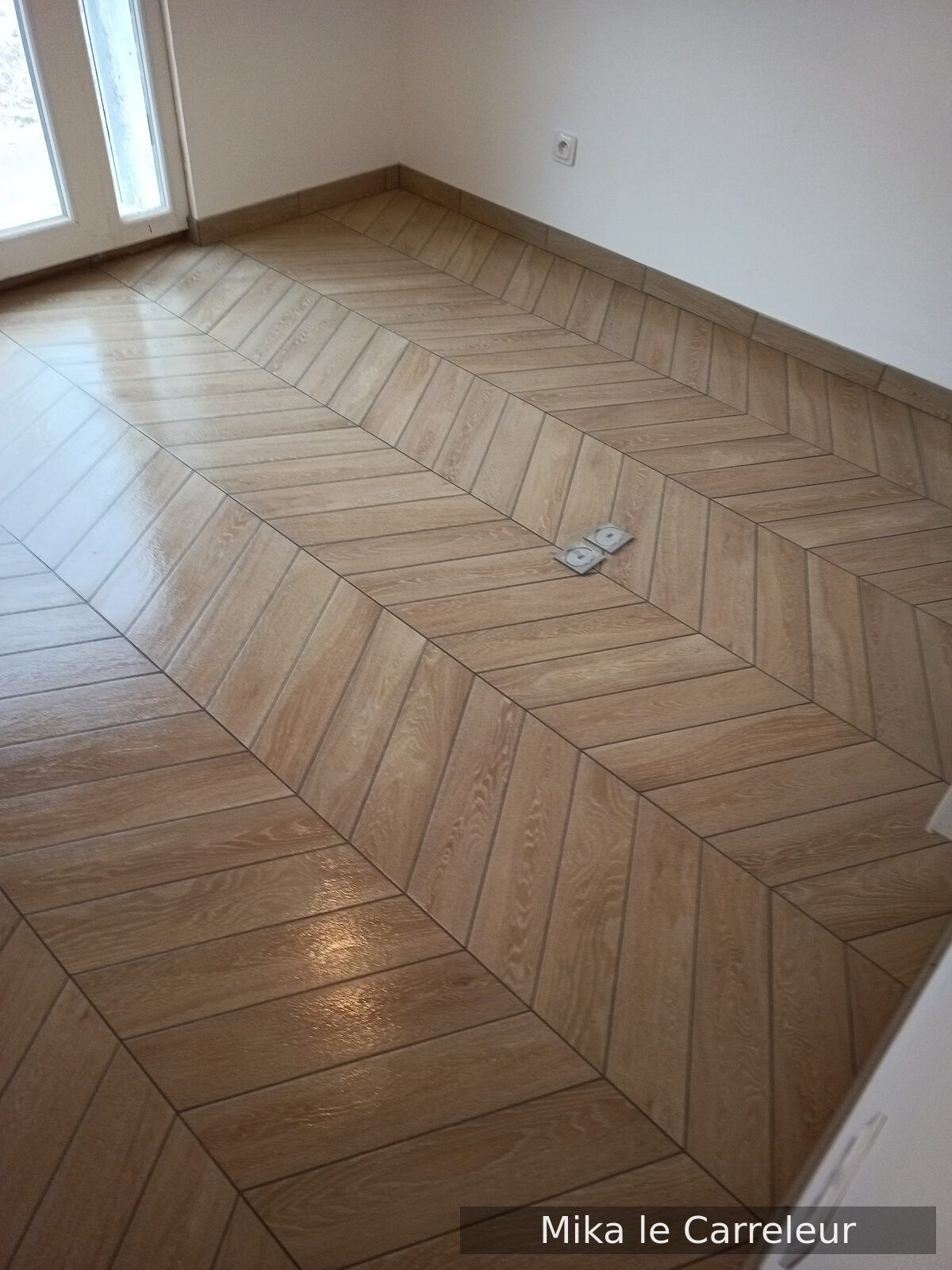 Pose de carrelage — sol intérieur : Sol carrelage chevrons bois à Haute-Marne